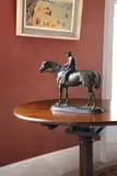 A bronze figure of a horse and jockey 'retour au pesage' by Jules Moigniez, BRONZE, sold Nov 2023