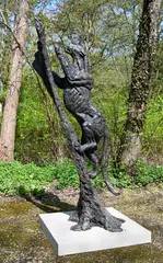 Leopard climbing a tree by Hamish Mackie, 2010, Bronze, sold Oct 2023
