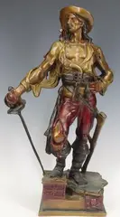 Untitled by Eutrope Bouret, Cold painted bronze sculpture of a pirate with sword standing on a treasure chest and Jolly Roger decorated base, sold Sep 2023