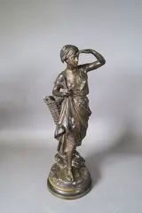 La pêcheuse à pieds by Eugène Laurent, Epreuve en bronze patinée signée sur la terrasse, sold Sep 2024