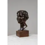 Tête de jeune femme by Maurice de Lysniewski, bronze à patine médaille, sold Jul 2023