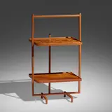 Folding occasional table by Jacques Adnet, c. 1950, leather over steel, mahogany, sold Jan 2023