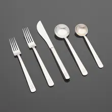 Modern flatware by Richard Meier, stainless steel, sold Jan 2023