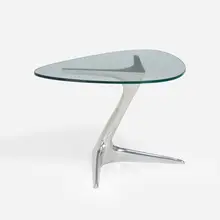 Unicorn occasional table by Vladimir Kagan, cast and polished aluminum, glass, sold Jan 2023