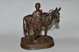 a bronze figure group of an Arab boy with his donkey, on a by Alfred Dubacand, bronze, sold Nov 2020