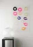 A wall mounted clear perspex bracelet holder by Susanna Heron, 1976, pencil, sold Mar 2020