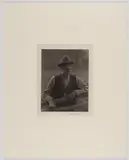 APPALACHIAN MAN PHOTOGRAPHIC PORTRAIT, platinum print on rice paper depicting a mustached older gentleman wearing hat and glasses, standing by a wooden fence by Doris Ulmann, pencil signature ", sold Dec 2023