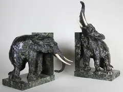Serres-livre aux éléphants by Ary Bitter, Epreuve en bronze, ivoire et marbre vert, sold Jun 2015