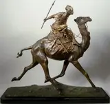 Le méhariste by Edouard Drouot, Epreuve en bronze à patine brun vert et dorée, sold Mar 2015