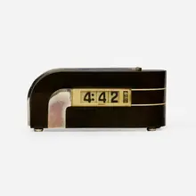 Zephyr table clock, model 304 by attribution Paul Fehér, 1933, enameled steel, chrome-plated aluminum, Bakelite, sold Jan 2023