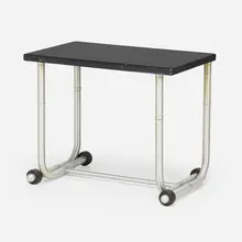 Occasional table by Warren McArthur, c. 1935, aluminum, lacquered wood, rubber, sold Jan 2023