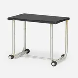 Occasional table by Warren McArthur, c. 1935, aluminum, lacquered wood, rubber, sold Jan 2023