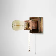 Sconce by Frank Lloyd Wright, c. 1915, copper-plated brass, sold Jan 2023