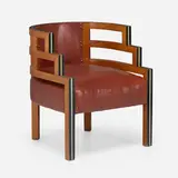 Armchair by Kem Weber, c. 1950, lacquered and stained mahogany, leather, brass, sold Jan 2023