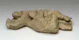 Sandstone sculpture - two tackling rugby players by Jonah Jones, sculpture, sold Apr 2024