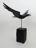 Crow flying with an egg in its mouth Signed and titled Painted wood with glass by Guy Taplin, sculpture, sold Dec 2019