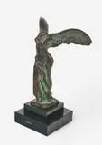 Winged Victory of Samothrace by Max Le Verrier, bronze with applied patina on stone base, sold Jan 2021