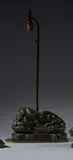 Lion dévorant un lapin by Clovis-Edmond Masson, Bronze à patine verte, sold Mar 2022
