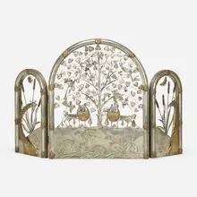 Fireplace screen by Sergio Bustamante, c. 1975, patinated and welded steel with repoussé and brass, sold Jan 2023