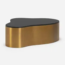 Freeform coffee table by Karl Springer, c. 1975, brass, painted glass, sold Jan 2023