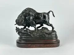Bison jouant avec un chien by Alphonse Alexandre Arson, Bronze soclé à patine brune, sold Jan 2025