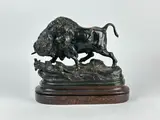 Bison jouant avec un chien by Alphonse Alexandre Arson, Bronze soclé à patine brune, sold Jan 2025