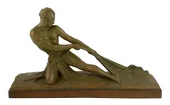 An Art Deco bronzed terracotta figure of a fisherman hauling a net from the sea, on integral plinth by Ugo Cipriani, sculpture, sold Jun 2023