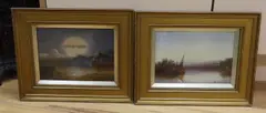Sail barge on an estuary and Beach scene at sunset by Claude Thomas Stanfield Moore, oil, sold Jun 2023