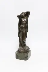 A standing female nude female, on marble base by Eugen Schlipf, sculpture, sold Apr 2023