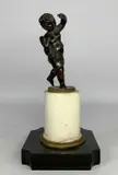 half draped, on milled edge base, on marble plinth and slate by Th Century Bronze Sculpture Of Cupid, BRONZE, sold Oct 2023