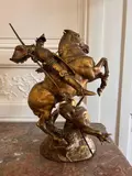 Saint Georges terrassant le dragon by Emmanuel Frémiet, Bronze à patine dorée, sold Jun 2025