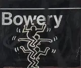 Ohne Titel (Three Stacked Figures) auf New Yorker U-Bahn-Schild der Station 'Bowery' in Lower Mahattan by Keith Haring, 1980, acrylic, sold Jun 2019