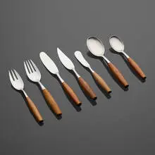 Fjord flatware by Jens Quistgaard, 1953, teak, stainless steel, sold Nov 2022