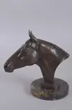 A PATINATED BRONZE BUST OF THE RACEHORSE MANDARIN, mounted on an Italian Portoro Nero circular marble base by William Newton, BRONZE, sold Feb 2025