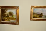 a rural scene of children fishing before cottages, signed by Les Parson, acrylic on canvas, sold Feb 2020