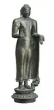 SRI LANKA, Polonnaruya Period by Standing Buddha On A Decorative Pedestal, bronze figure of standing Buddha with robe draped across body and thrown over the left shoulder, the right shoulder bare, sold Oct 2013