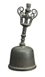 Bali by Priest’s Bell, bronze, plain body with a decorative moulded handle and a male figure riding a four-legged animal on the finial, sold Oct 2013