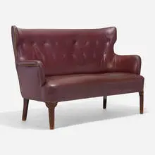 Sofa by Ernst Kühn, c. 1945, leather, beech, steel, sold Nov 2022