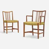 Chairs, set of two by Hans J. Wegner, c. 1945, carved oak, upholstery, brass, sold Nov 2022