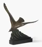 Mouette volant au-dessus d'une vague by Alexandre Kelety, bronze, offered Mar 2024