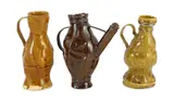 A series of three crumpled monochrome glazed pottery jugs by Philip Egin, sculpture, sold Dec 2022