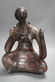 A terracotta abstract sculpture of a seated by Manuel Felguérez, sculpture, sold Nov 2022