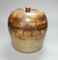 A brown glazed stoneware jar and cover by William Marshall, sculpture, sold Nov 2022