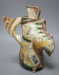 An abstract polychrome glazed stoneware jug and cover on tripod base by Angus Suttie, sculpture, sold Nov 2022