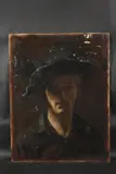 Self portrait, head and shoulders of the artist in a floppy hat by George Weissbort, Oil on board, offered Jan 2025