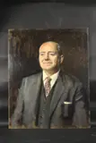 Portrait, head and shoulders of a gentleman in a suit, shirt, and tie by George Weissbort, Oil on board, sold Jan 2025
