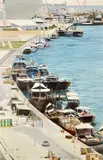 View of a middle eastern port with by P. Davies, 1981, oil on canvas, sold Aug 2022