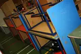 eight blue and two red some stamped Pel to the underside all 120x60x70cm high by Ten Coloured Classroom Tables, drawing, sold Nov 2019