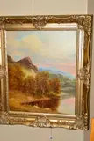 a mountainous lakeside landscape with an Angler and his dog to the foreground by Andrew Grant Kurtis, oil, sold Oct 2019