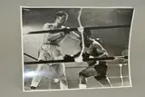 the black and white photograph is signed, To Jan, With Best Wishes, Johnny Prescott, not dated by Johnny Prescott In Action, photograph, sold Oct 2019